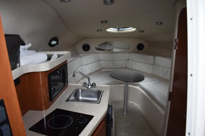 Slide: The Image of 2005 Regal Commodore 2665 cabin interior with kitchenette and seating area. - 30