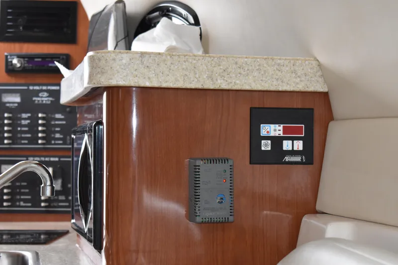 Slide: The Image of Interior of 2005 Regal Commodore 2665 boat with control panel and countertop. - 37