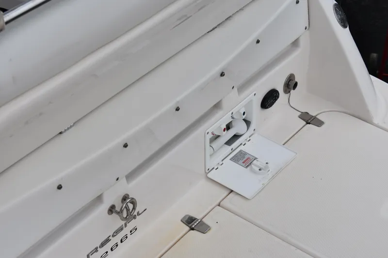 Slide: The Image of 2005 Regal Commodore 2665 boat deck with control panel and logo. - 6