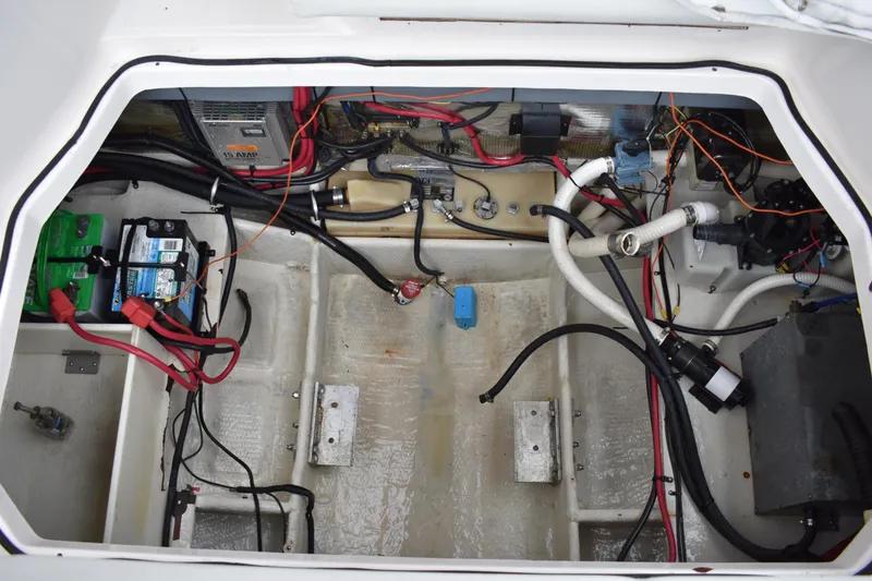 Slide: The Image of Engine compartment of 2005 Regal Commodore 2665 boat, showing wiring and battery setup. - 9