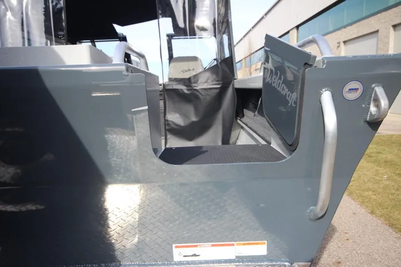 Slide: The Image of 2023 Weldcraft 210 Revolution F200XB boat side entry view. - 20