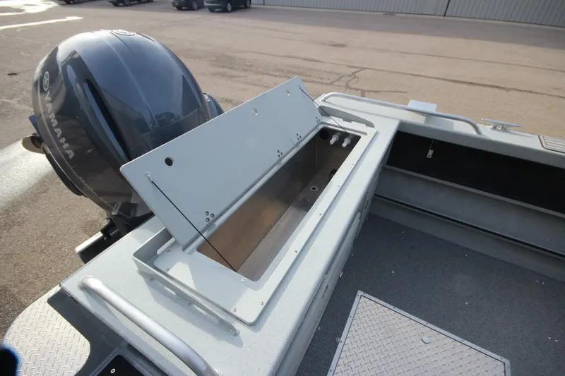 Slide: The Image of 2023 Weldcraft 210 Revolution F200XB boat with open storage compartment. - 22