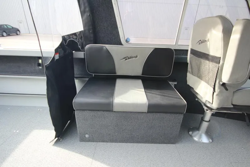 Slide: The Image of 2023 Weldcraft 210 Revolution F200XB boat interior seating. - 25
