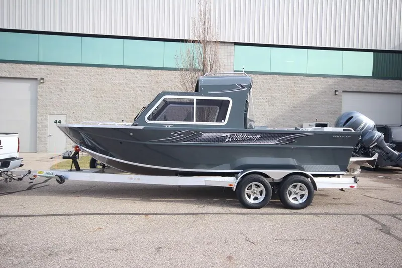 Slide: The Image of 2023 Weldcraft 210 Revolution F200XB boat on trailer, in stock. - 33