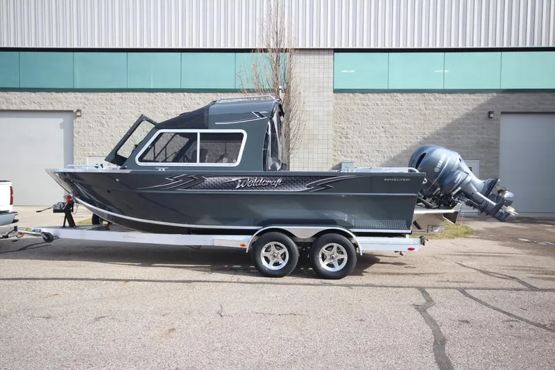 Slide: The Image of 2023 Weldcraft 210 Revolution F200XB boat on trailer, side view. - 35