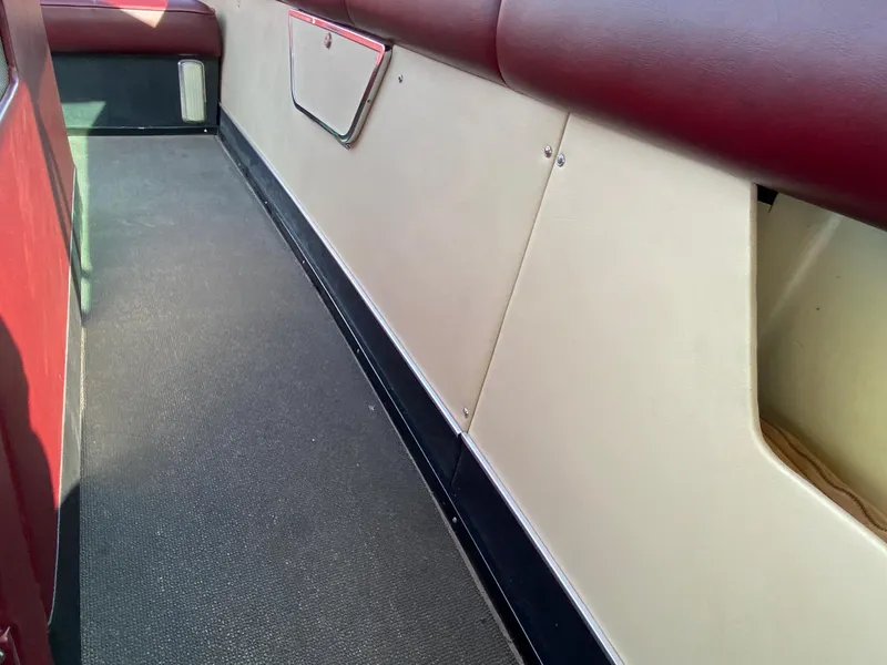 Slide: The Image of Interior of a 1968 Century Coronado boat with red and white upholstery. - 14