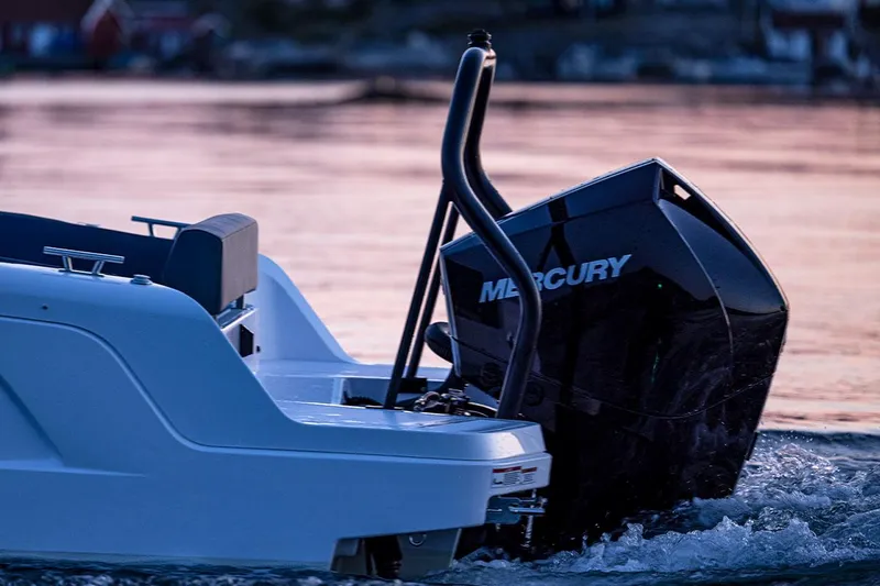 Slide: The Image of 2022 Axopar 22 T-Top boat with Mercury outboard engine at sunset. - 16