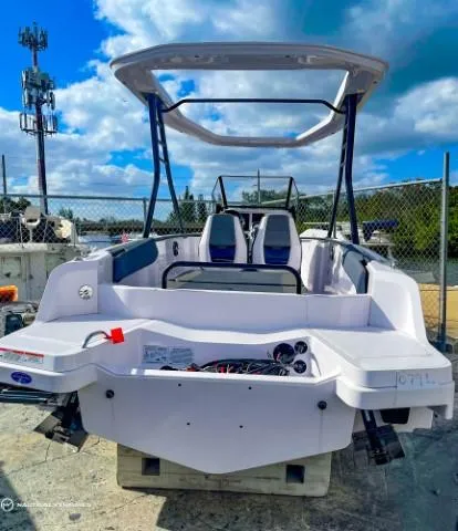 Slide: The Image of 2022 Axopar 22 T-Top boat with dual seats and open deck. - 7