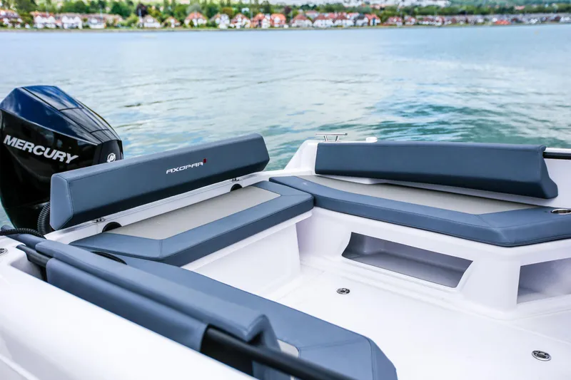 Slide: The Image of 2022 Axopar 22 T-Top boat with Mercury engine, rear seating area. - 8