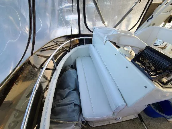 Slide: The Image of 1995 Silverton 34 Aft Cabin Motor Yacht interior seating area. - 13