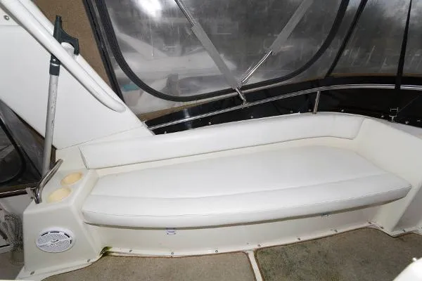 Slide: The Image of Interior seating area of 1995 Silverton 34 Aft Cabin Motor Yacht with white cushioned bench. - 14