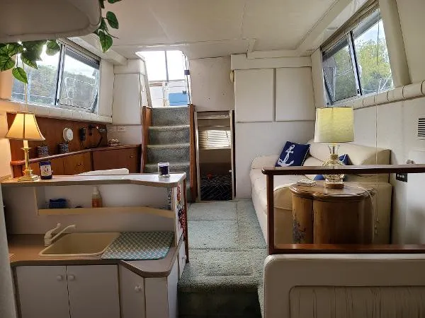 Slide: The Image of Interior of 1995 Silverton 34 Aft Cabin Motor Yacht with cozy living area and kitchenette. - 20