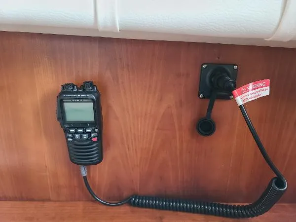 Slide: The Image of Handheld radio and power socket on 1995 Silverton 34 Aft Cabin Motor Yacht. - 27