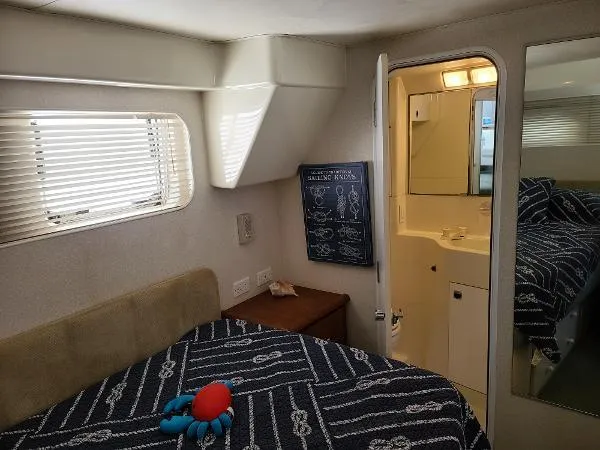Slide: The Image of 1995 Silverton 34 Aft Cabin Motor Yacht bedroom with ensuite bathroom - 28