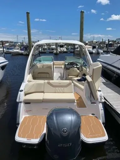 Slide: The Image of 2019 Regal 23obx boat docked at marina, featuring Yamaha 250 outboard motor. - 0