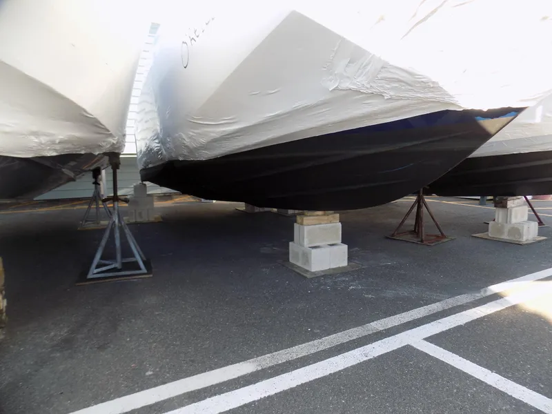 Slide: The Image of 2019 Regal 23obx boat stored on blocks, covered in protective wrap. - 3