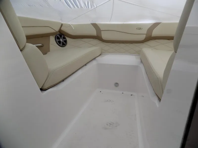 Slide: The Image of Interior of 2019 Regal 23obx boat with beige seating and speaker. - 8