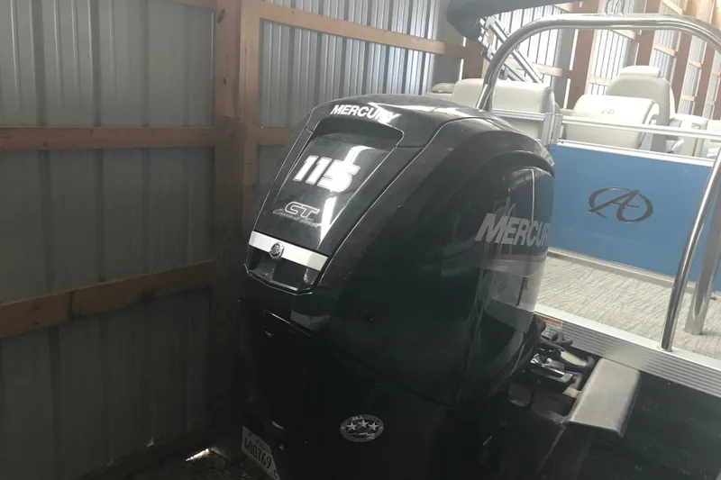 Slide: The Image of 2022 Avalon VENTURE QUAD LOUNGE with Mercury 115 CT outboard motor in storage. - 12