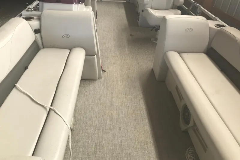Slide: The Image of 2022 Avalon VENTURE QUAD LOUNGE interior with beige seating and spacious layout. - 17