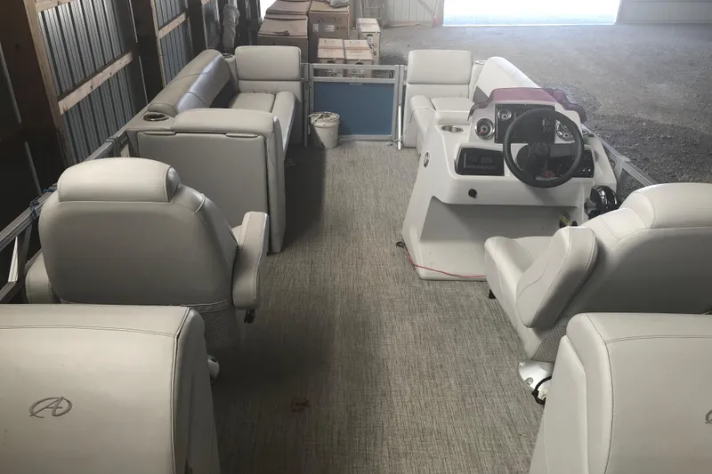 Slide: The Image of 2022 Avalon VENTURE QUAD LOUNGE interior with plush seating and modern dashboard. - 18