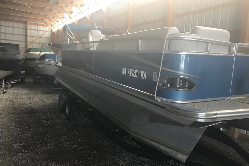 The Image of 2022 Avalon VENTURE QUAD LOUNGE pontoon boat in storage facility. - 8