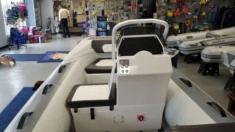 Slide: The Image of 2023 Highfield Classics inflatable boat displayed in a showroom. - 2