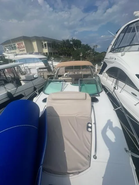 Slide: The Image of 2018 Schaefer 365 yacht docked among other boats under a partly cloudy sky. - 14
