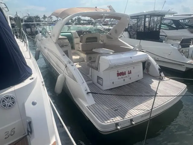 Slide: The Image of 2018 Schaefer 365 yacht docked at marina, featuring spacious deck and modern design. - 2