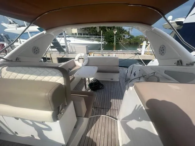 Slide: The Image of Luxurious 2018 Schaefer 365 yacht interior with seating and helm, docked at marina. - 20
