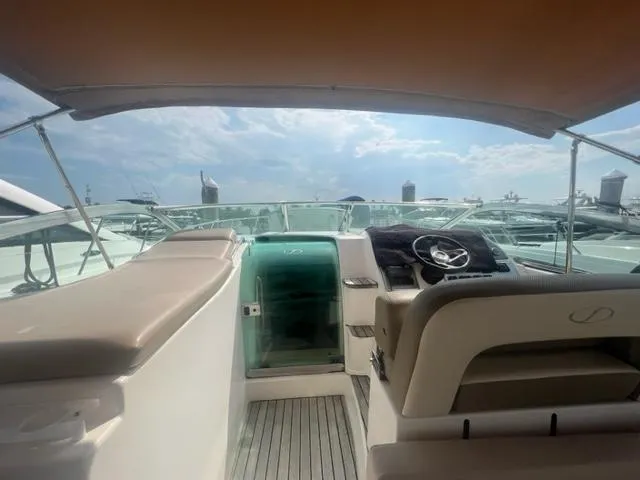 Slide: The Image of Interior view of 2018 Schaefer 365 yacht with helm and seating under canopy. - 21