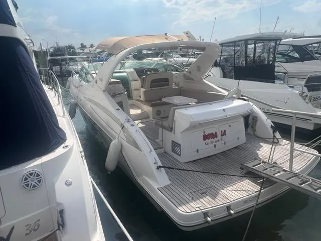 Slide: The Image of 2018 Schaefer 365 yacht docked at marina, featuring spacious deck and modern design. - 6