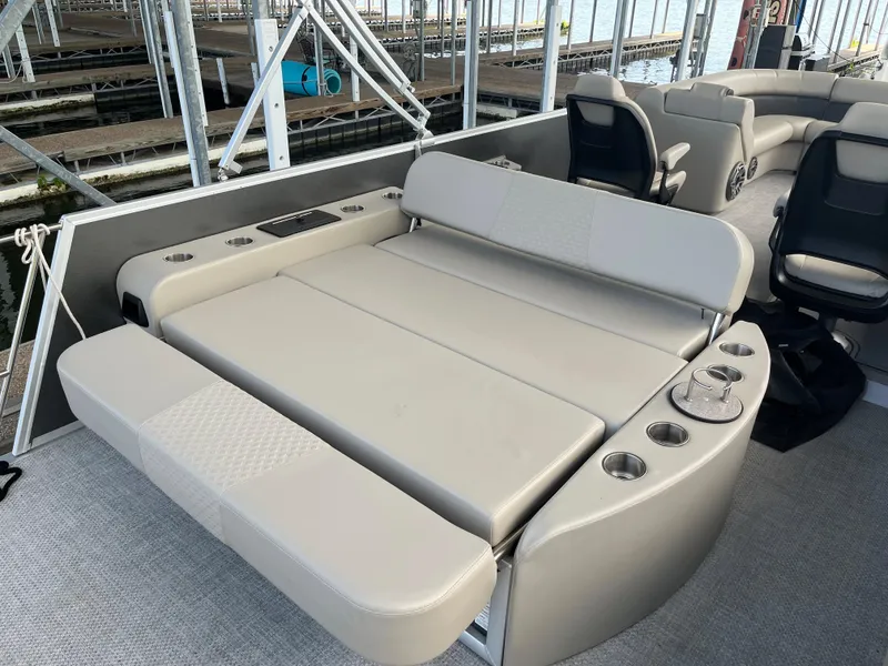 Slide: The Image of 2022 Premier 250 SunSation RL boat with spacious seating and cup holders. - 7