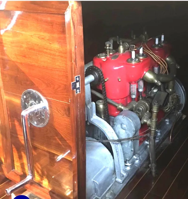Slide: The Image of Engine of 2004 Custom 28 Rum Runner Richard Speas, featuring red components and wooden paneling. - 10
