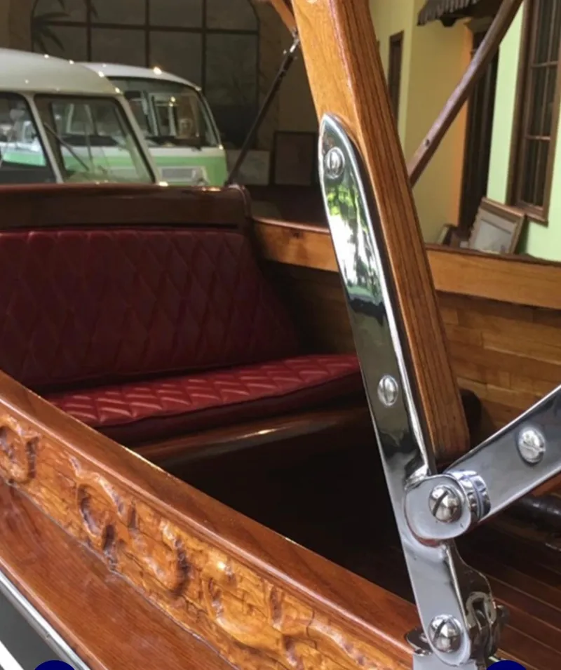 Slide: The Image of Custom 2004 28 Rum Runner Richard Speas boat with wooden details and red leather seating. - 11