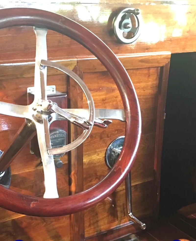 Slide: The Image of Wooden steering wheel of 2004 Custom 28 Rum Runner Richard Speas boat. - 5