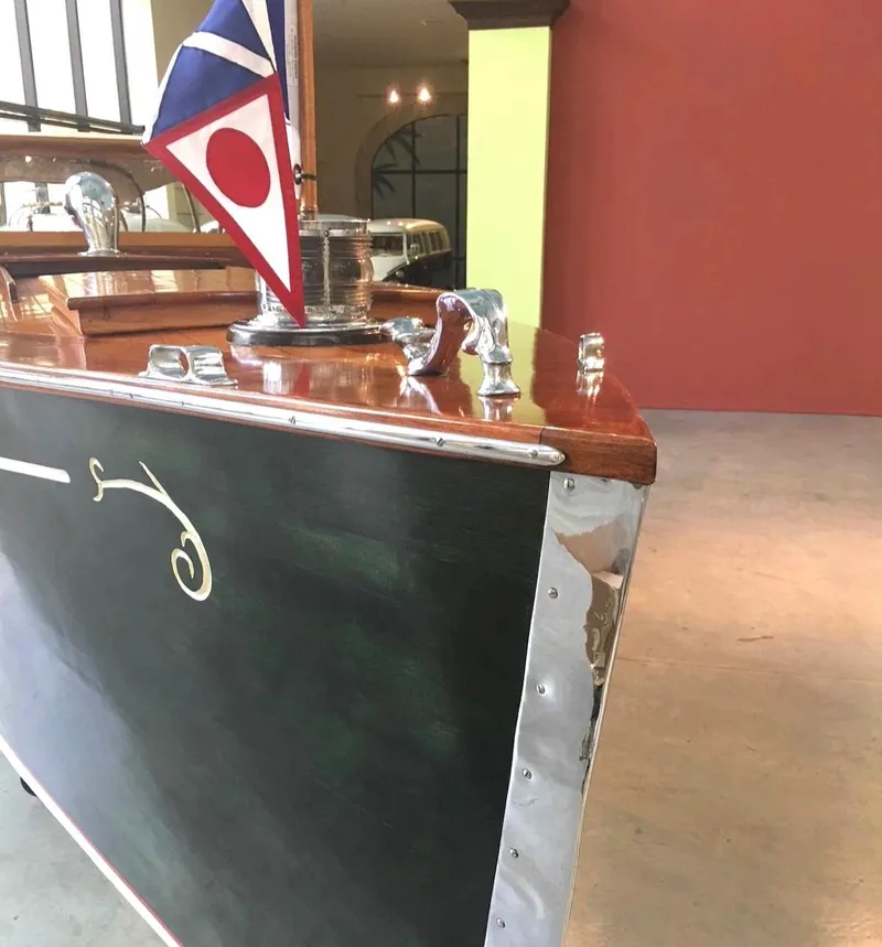 Slide: The Image of Custom 2004 28 Rum Runner Richard Speas boat with polished wood and nautical flag. - 6