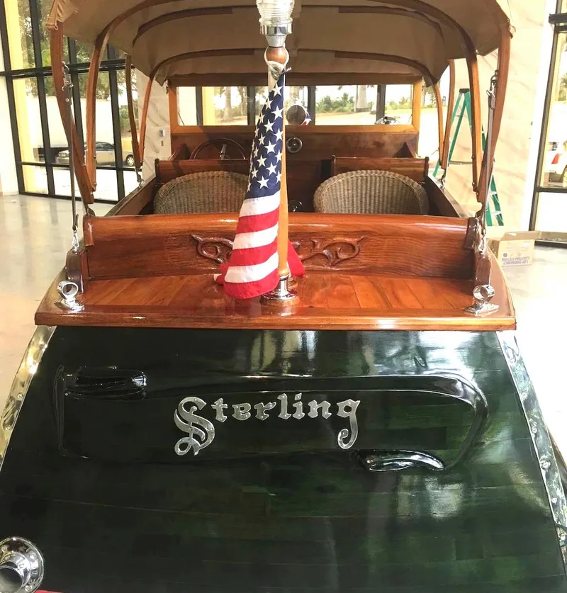 Slide: The Image of Custom 2004 Rum Runner boat with American flag and "Sterling" nameplate. - 8