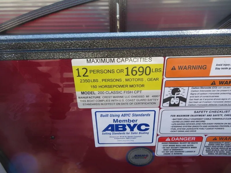 Slide: The Image of 2022 Crest Classic Fish 200 SF capacity and safety labels, 12 persons or 1690 lbs, 150 HP motor. - 11