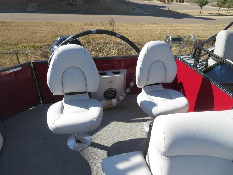 Slide: The Image of 2022 Crest Classic Fish 200 SF boat interior with white seats and red accents. - 20