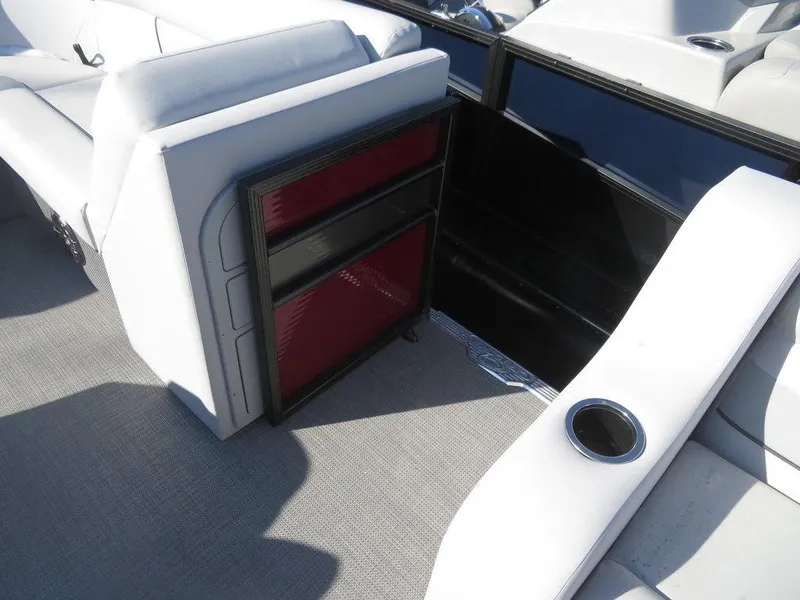 Slide: The Image of 2022 Crest Classic Fish 200 SF boat interior with storage compartment and seating. - 6