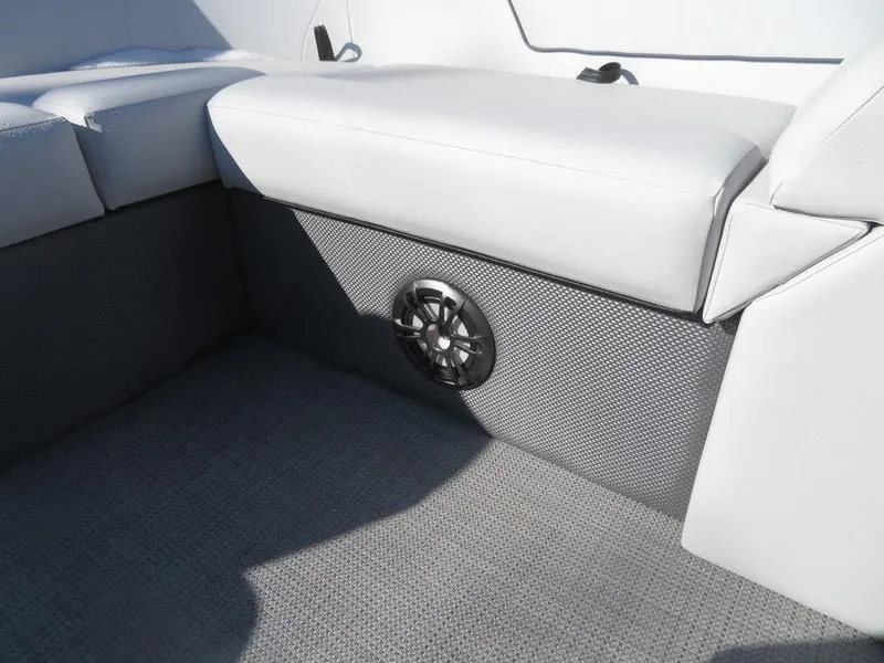 Slide: The Image of 2022 Crest Classic Fish 200 SF boat interior with cushioned seating and speaker. - 8