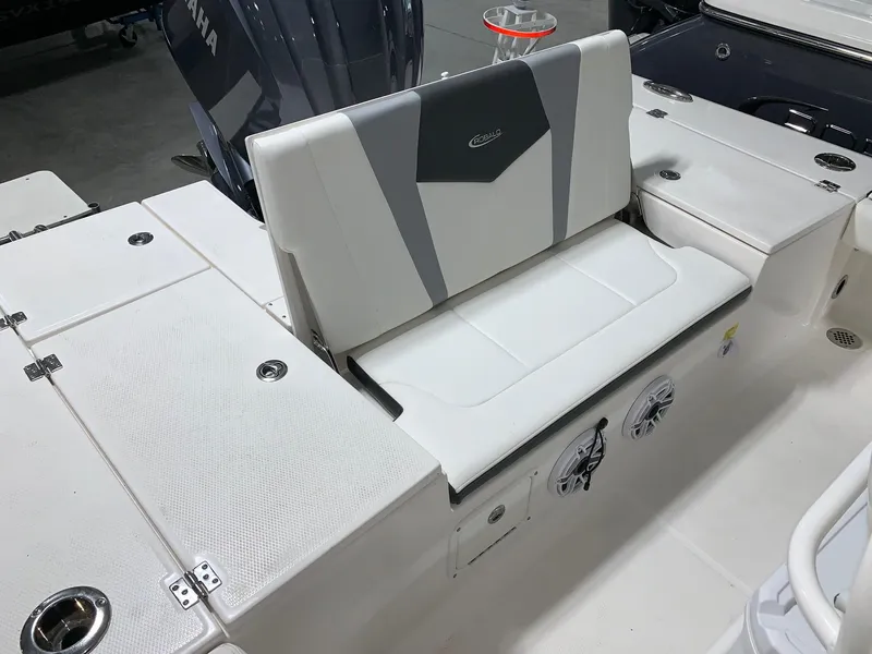 Slide: The Image of 2024 Robalo 246 Cayman boat seating area with storage compartments. - 5