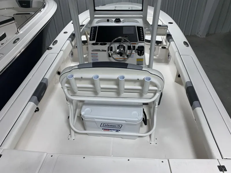 Slide: The Image of 2024 Robalo 246 Cayman boat interior with console and seating. - 7