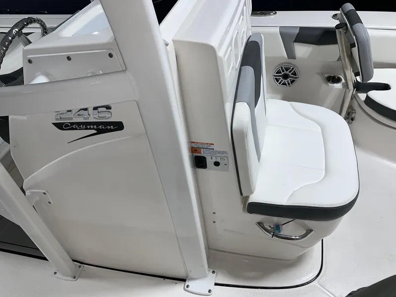 Slide: The Image of 2024 Robalo 246 Cayman boat interior, white seating and console details. - 12