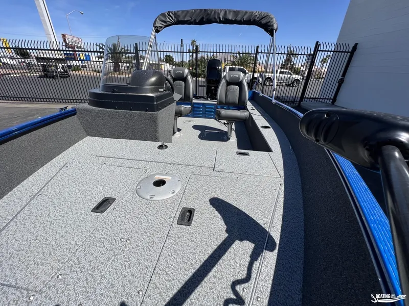 Slide: The Image of 2022 Lund 1650 Angler SS fishing boat with spacious deck and seating. - 8