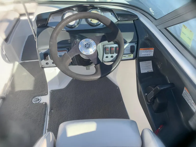 Slide: The Image of 2012 Yamaha Boats SX190 dashboard and steering wheel. - 6