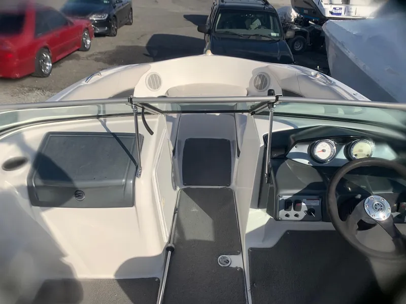 Slide: The Image of 2012 Yamaha Boats SX190 interior cockpit view with steering wheel and dashboard. - 7