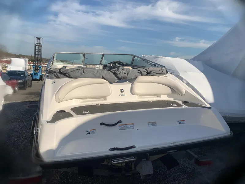 Slide: The Image of 2012 Yamaha Boats SX190, rear view, docked on a sunny day. - 9