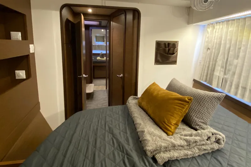 Slide: The Image of Luxurious interior of 2022 Lagoon 42 yacht with cozy bedroom and modern design. - 15