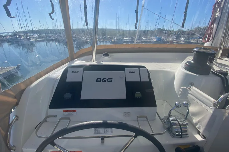 Slide: The Image of Helm of 2022 Lagoon 42 catamaran with B&G navigation system in marina. - 5